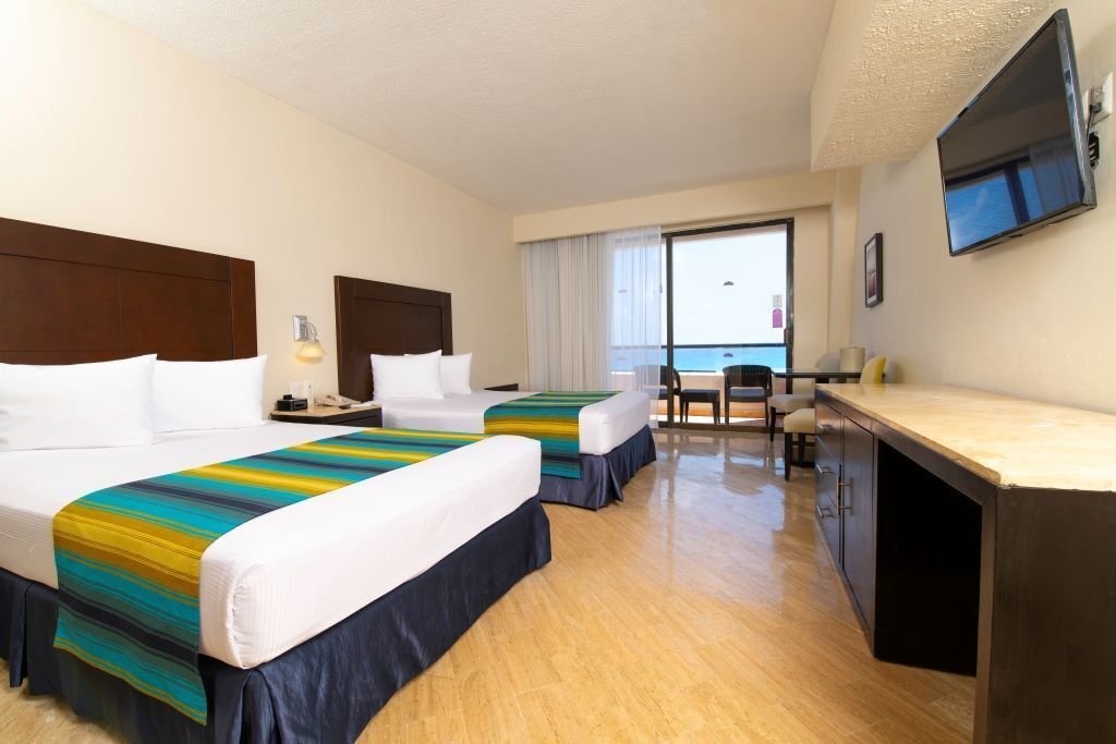 Estándar 2 Camas Dobles Vista al Mar (2 Adultos – 2 Niños)